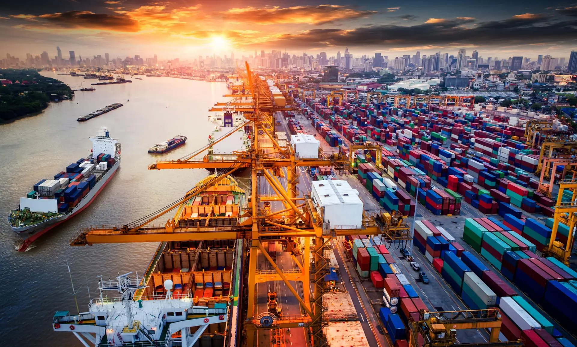 A view of a busy shipping port with cranes and containers